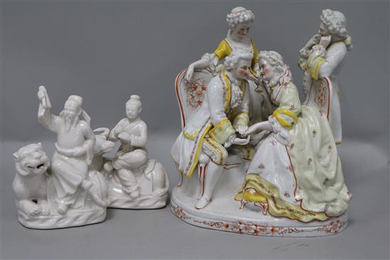 A porcelain figure and two Chinese ornaments